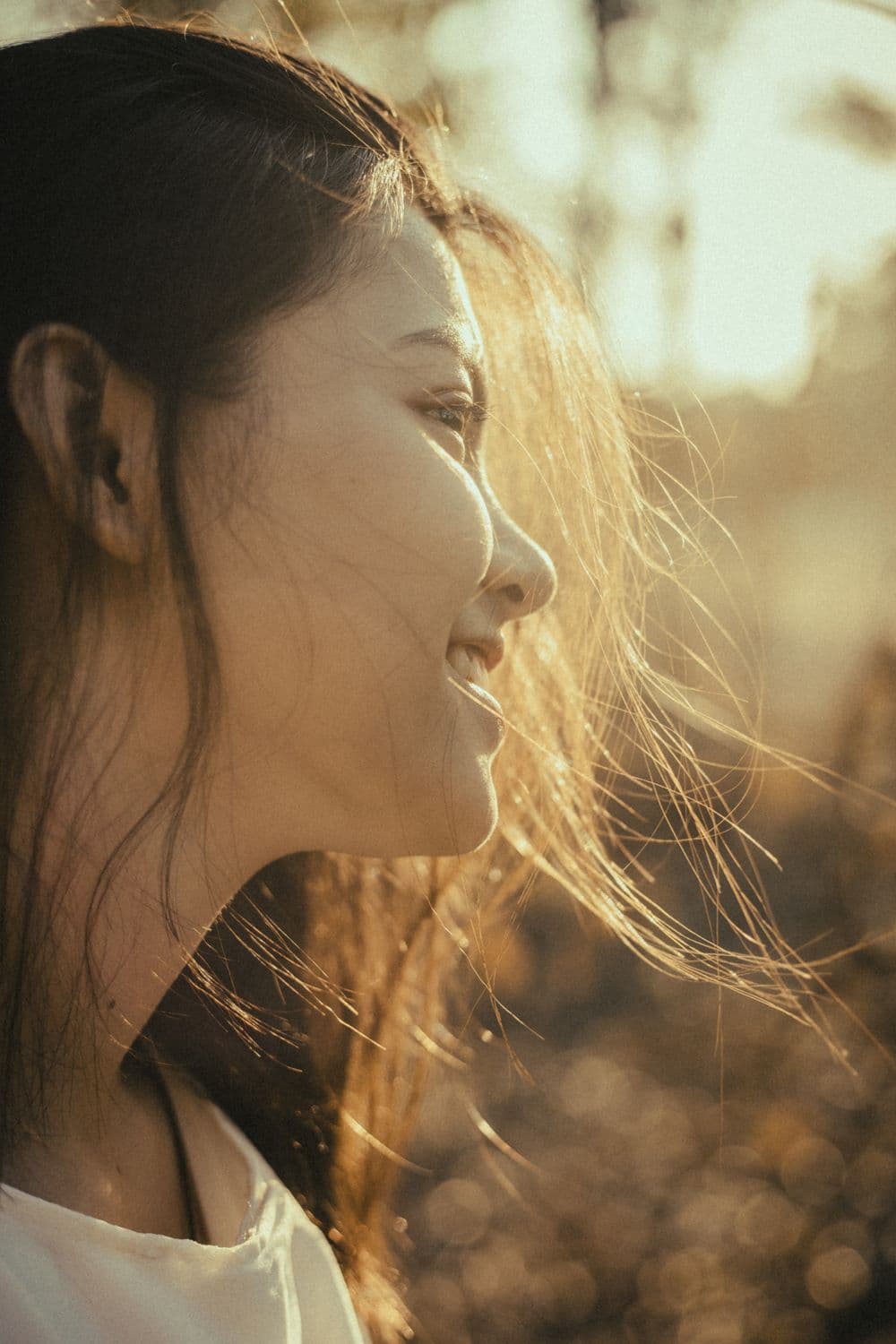 A calm face in warm golden-hour light